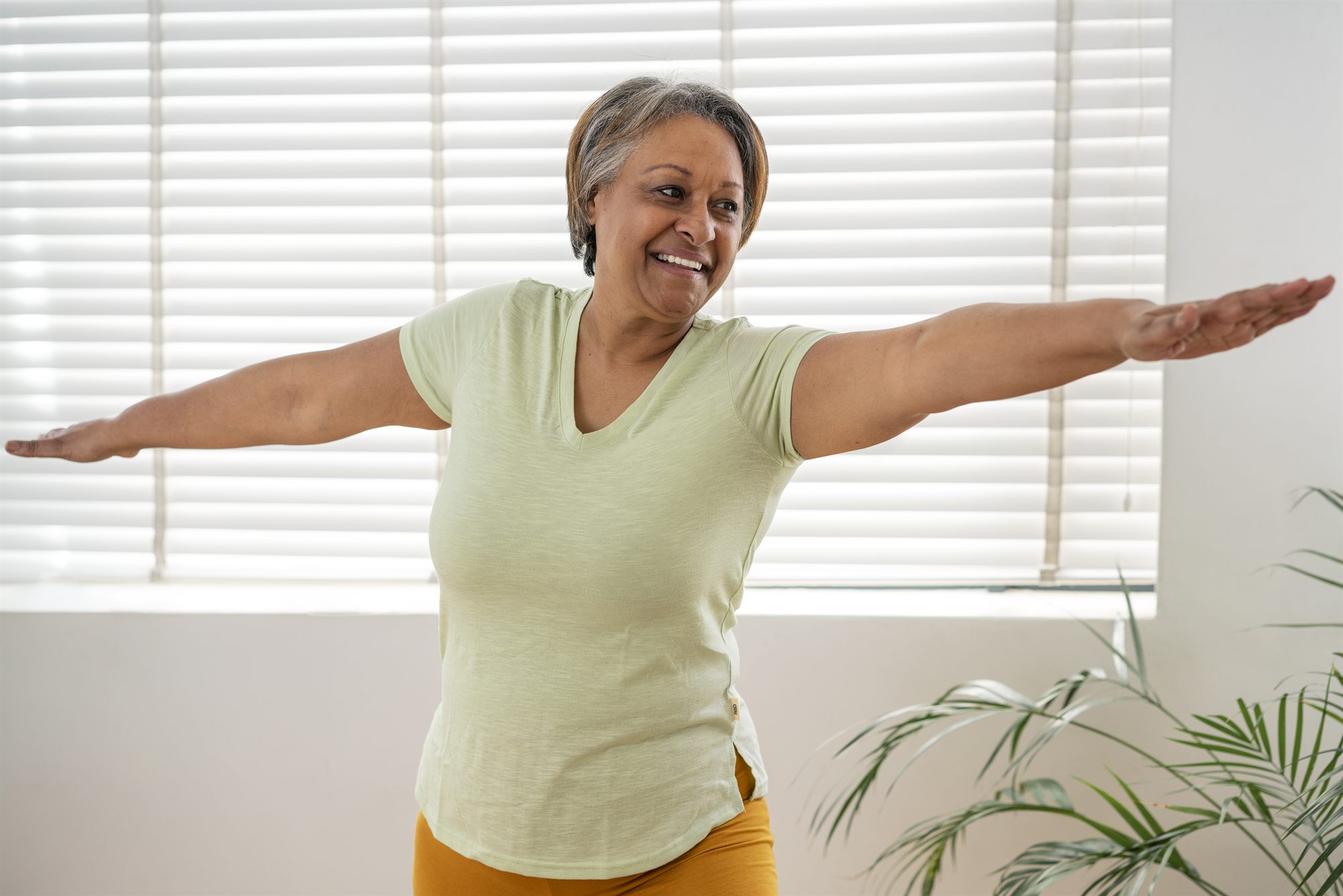 Happy mature woman with healthy joints and active lifestyle - Joint Genesis user testimonial